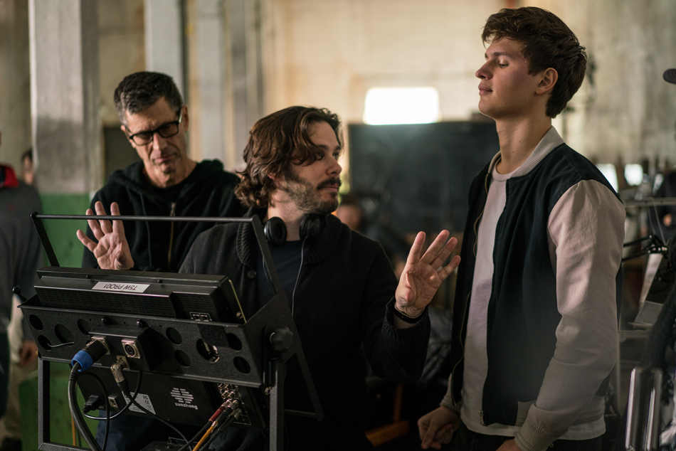 A behind the scenes shot of Ansel Elgort with crew