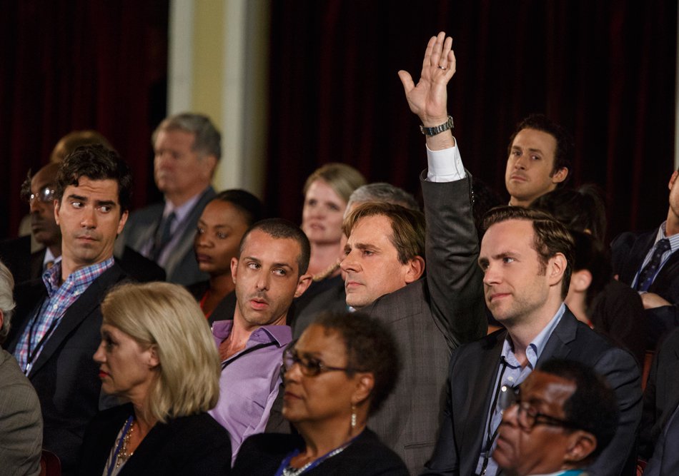 Steve Carrell raising his hand in a scene from The Big Short