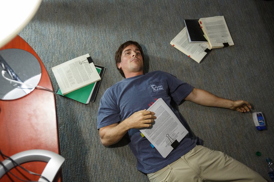 A shot of Christian Bale in his office from above, in the movie The Big Short