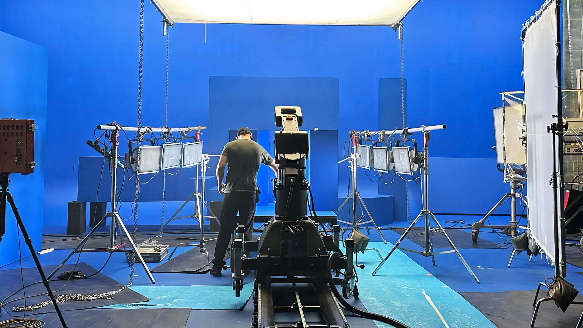 PX_segments_commercials_v3 person on blue screen commercial set with l.e.d. panel lights